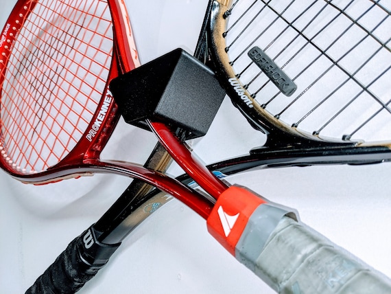 Exploring the Meaning Behind Crossed Tennis Rackets in Professional Matches